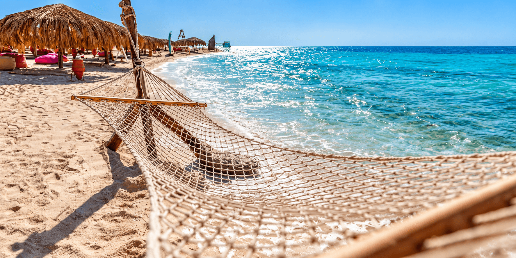 Relaxing hammock on the island beach from the Hula Hula collection