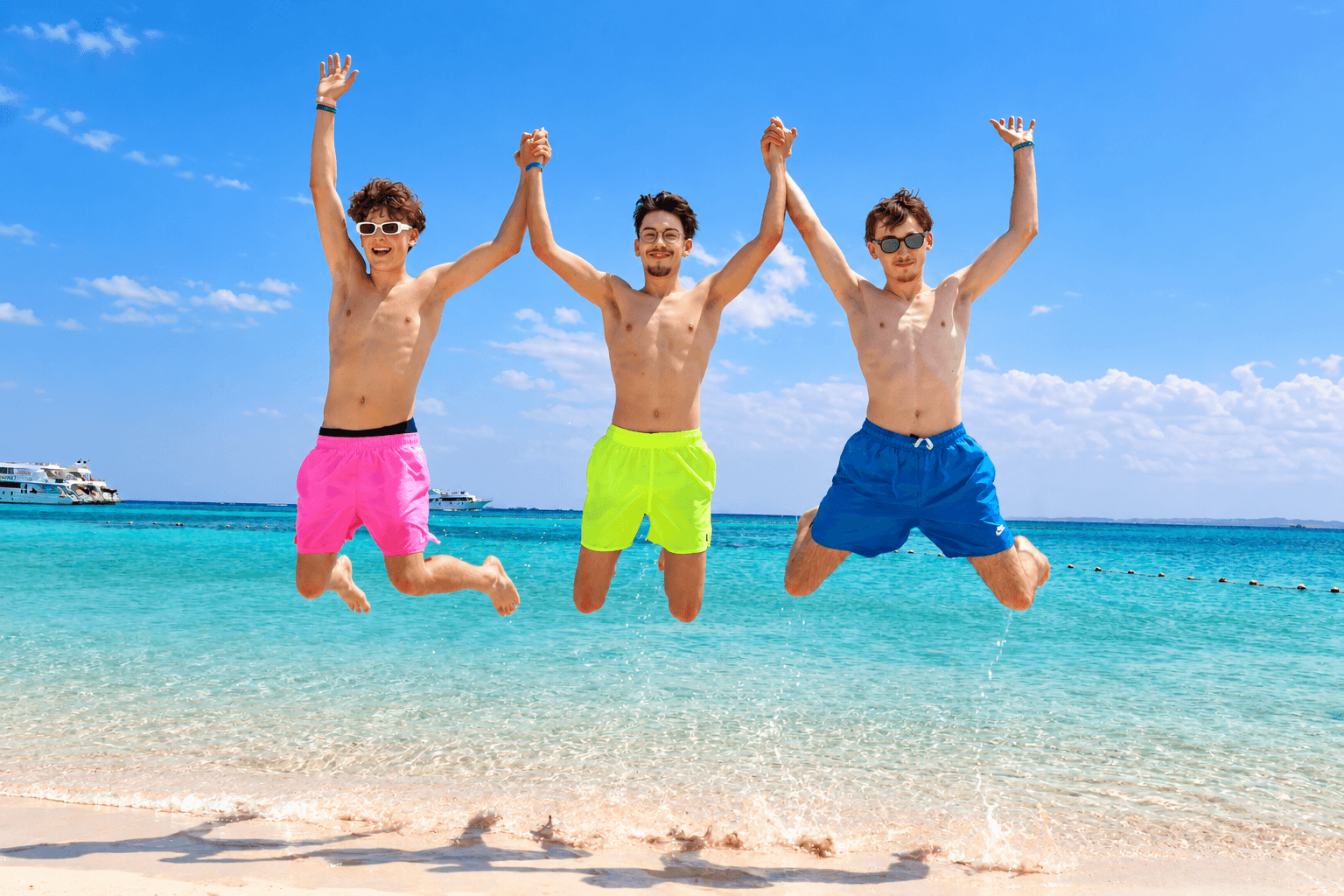 Travelers jumping at the Red Sea beach, from the Orange Bay photo collection