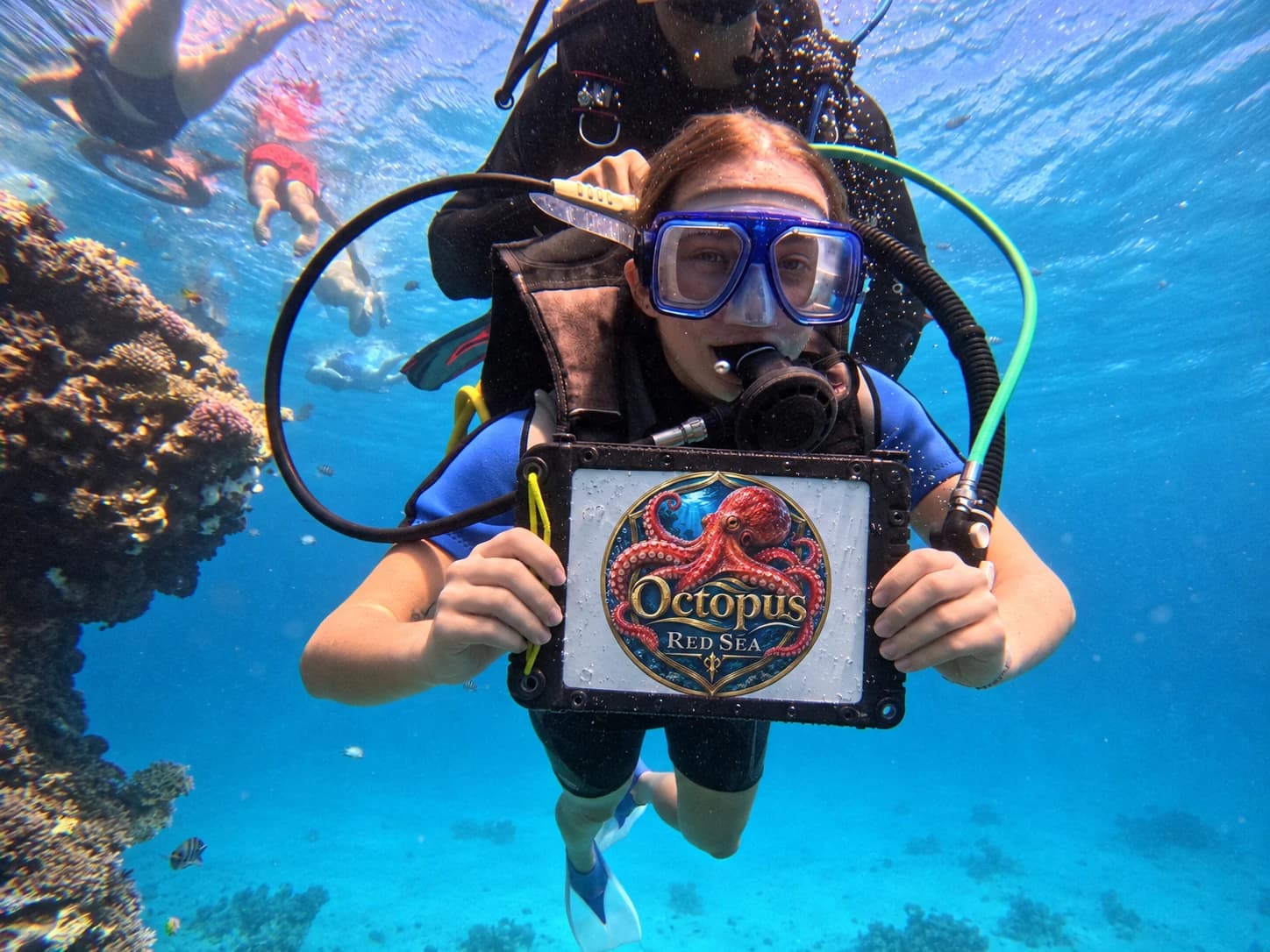 Diver with a blue mask and underwater Octopus Red Sea branded placard