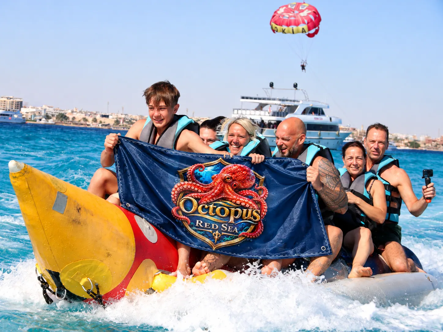 Client-supplied Red Sea holiday promotional photo with digitally added Octopus flag