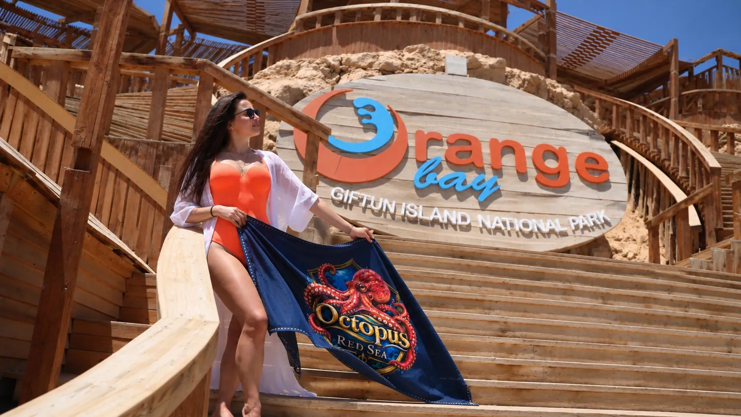 Client-supplied Red Sea holiday promotional photo with digitally added Octopus flag