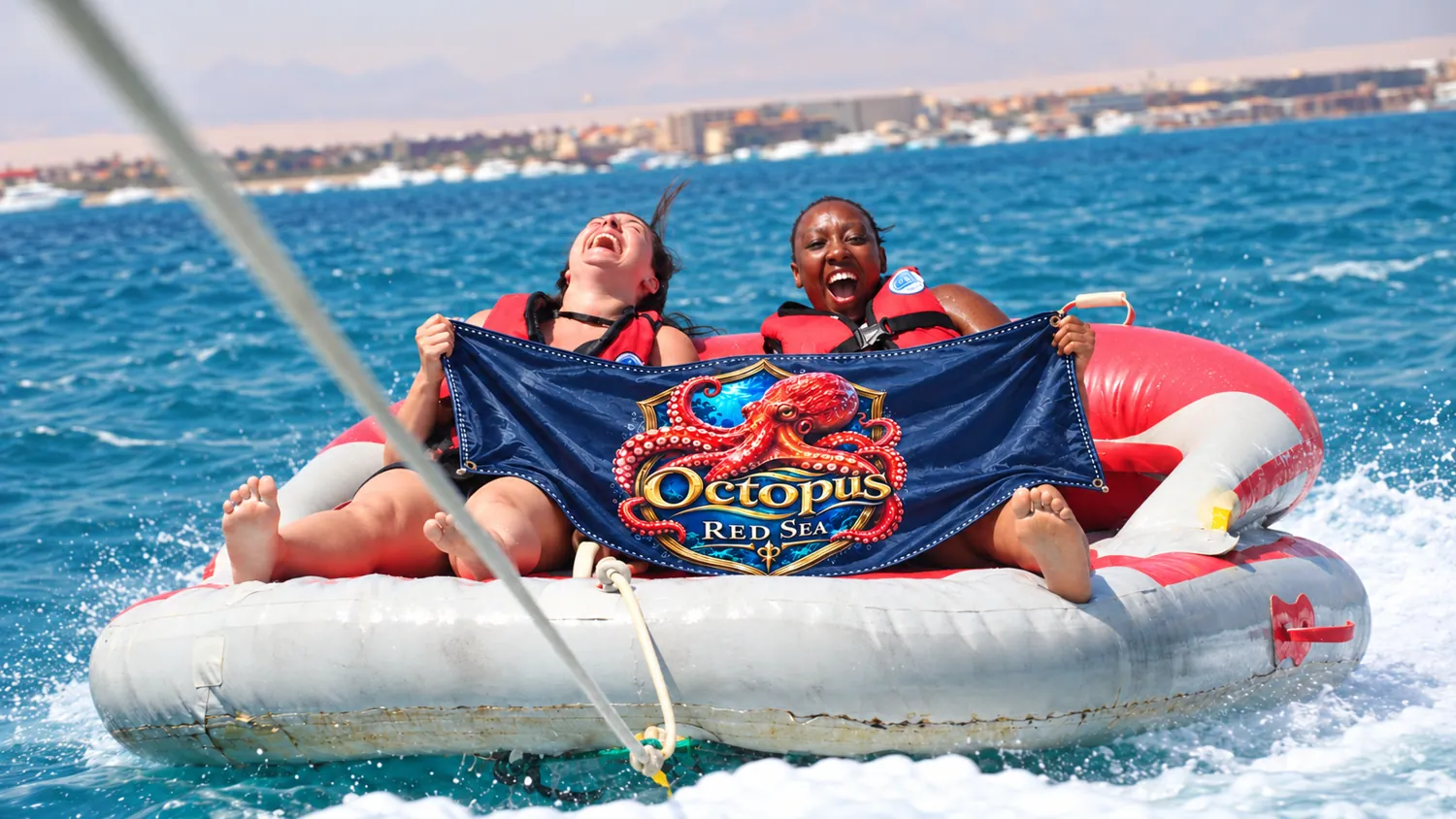 Client-supplied Red Sea holiday promotional photo with digitally added Octopus flag