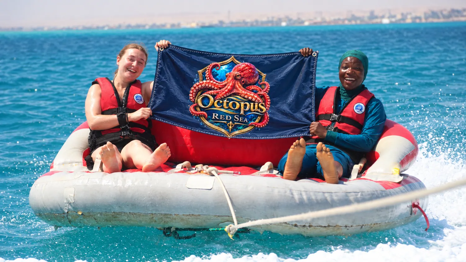 Client-supplied Red Sea holiday promotional photo with digitally added Octopus flag