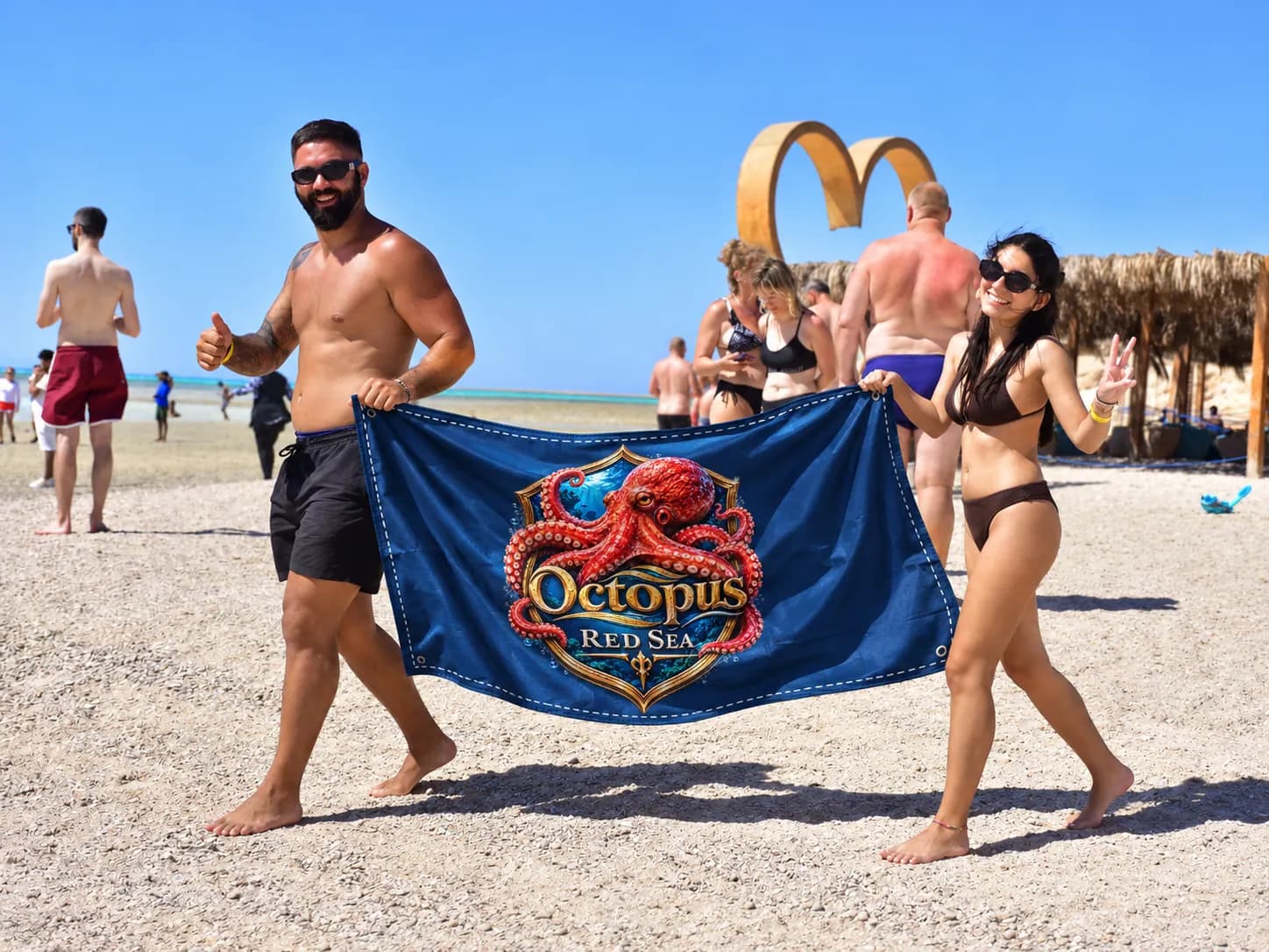 Client-supplied Red Sea holiday promotional photo with digitally added Octopus flag