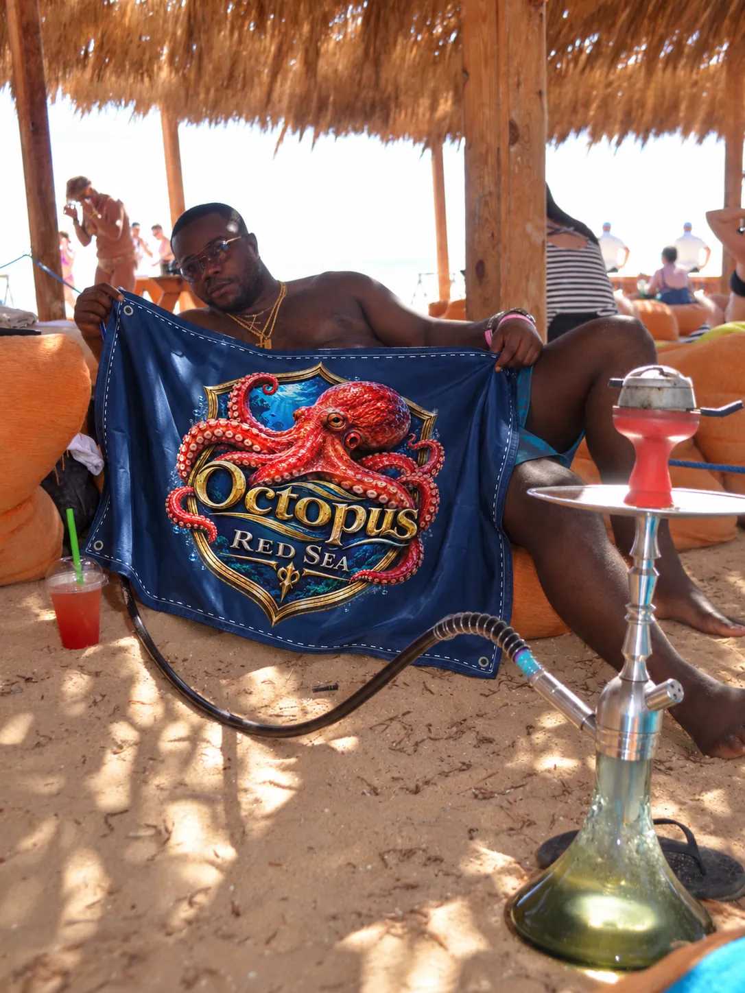 Client-supplied Red Sea holiday promotional photo with digitally added Octopus flag