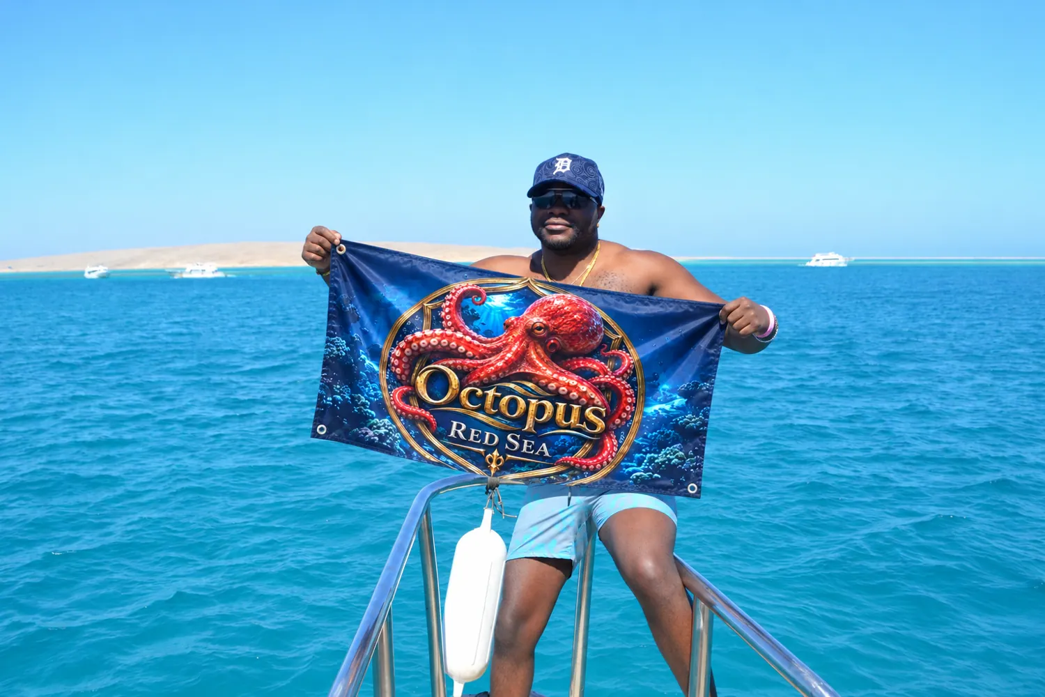 Client-supplied Red Sea holiday promotional photo with digitally added Octopus flag