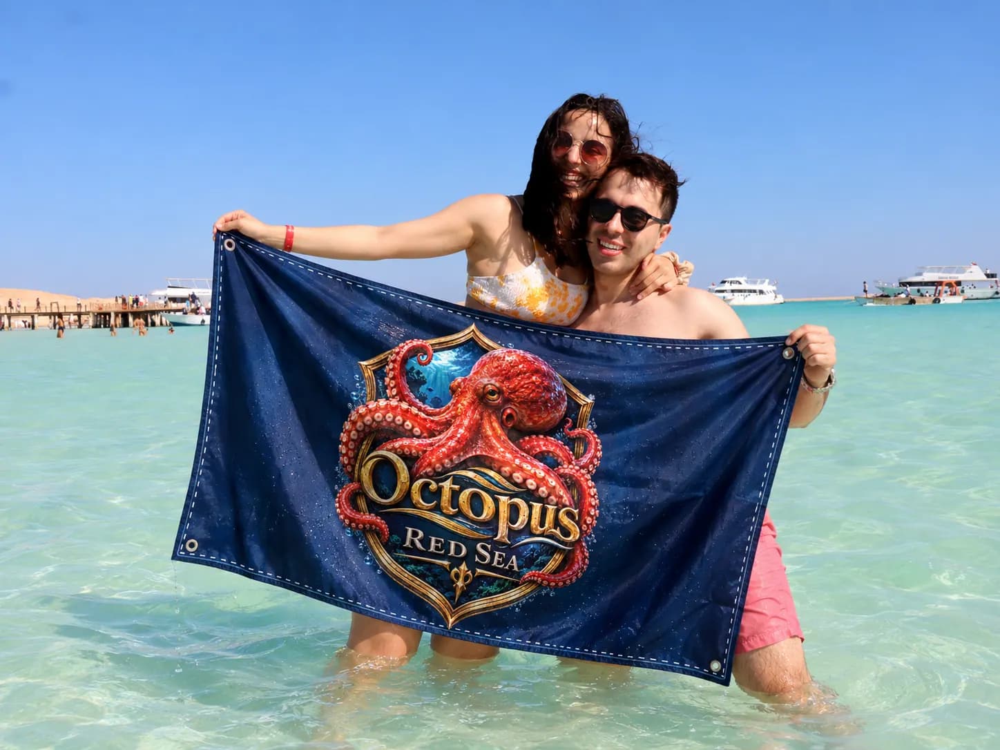 Client-supplied Red Sea holiday promotional photo with digitally added Octopus flag