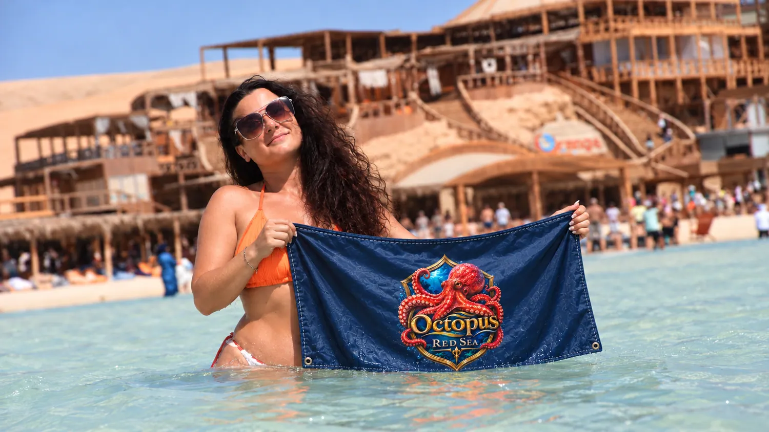 Client-supplied Red Sea holiday promotional photo with digitally added Octopus flag